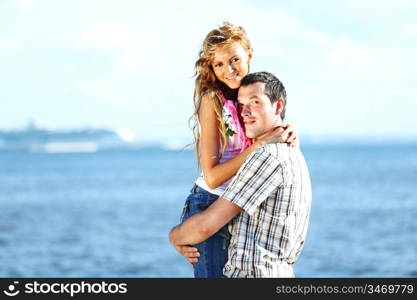 man and woman hug in the sky and sea on sea