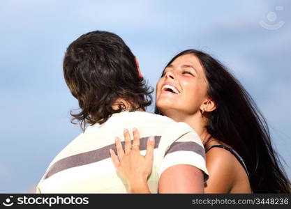 man and woman hug sky on background