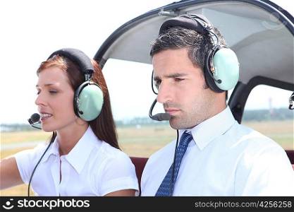 Man and woman in a light aircraft