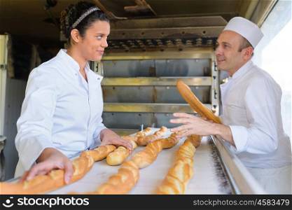 man and woman in bakery