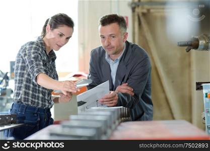 man and woman in factory