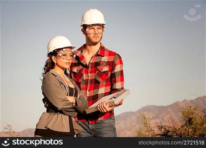 Man and woman in hardhats