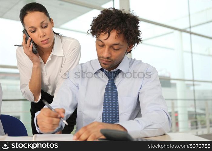 Man and woman in office