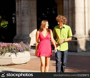 Man and woman in the city ? walking on a summer day