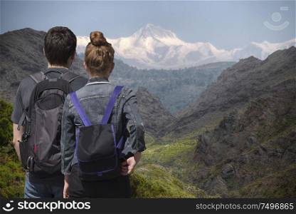 Man and woman in the mountains with a backpack