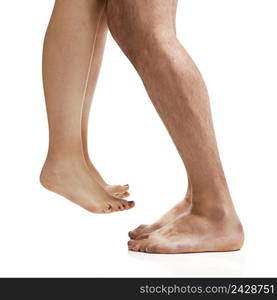 Man and woman legs isolated on a white background