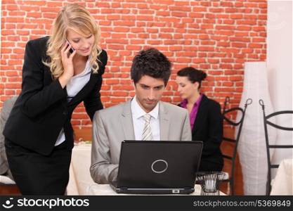 Man and woman looking at a laptop computer