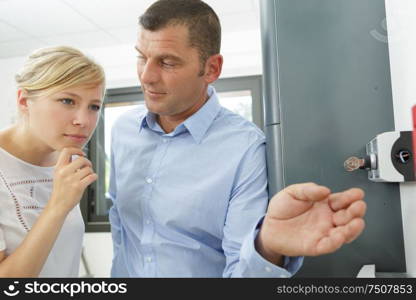 man and woman looking at access to lobby