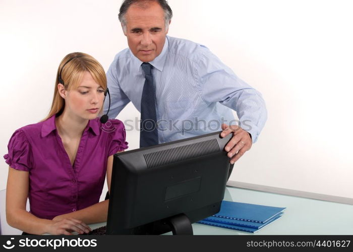 Man and woman looking at computer screen