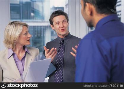 man and woman meeting in office