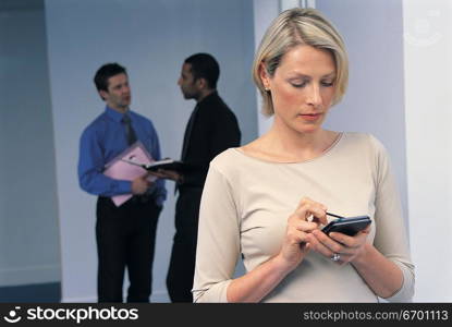 man and woman meeting in office and using mobile phone