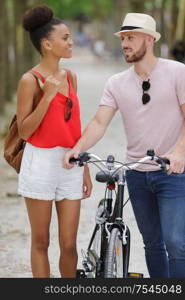 man and woman on a bicycle