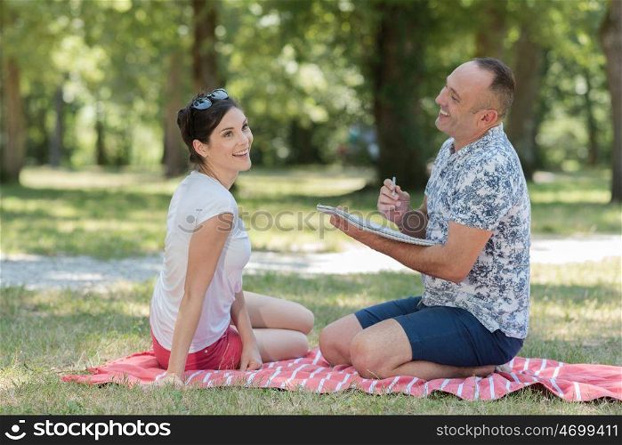 man and woman on a picnic