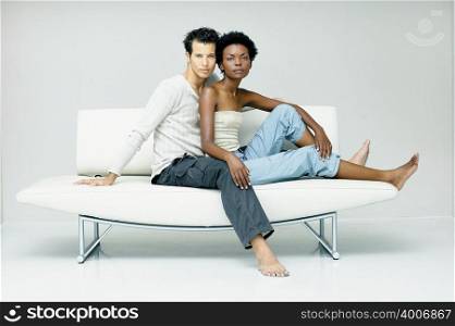 Man and woman on modern sofa