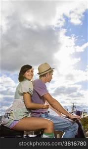 Man and woman on scooter