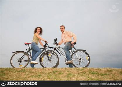 man and woman on the bicycles
