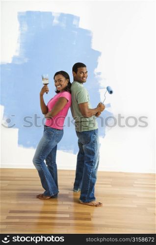 Man and woman painting
