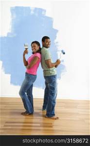 Man and woman painting