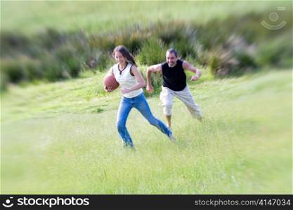 Man and Woman Playing Ball in Field