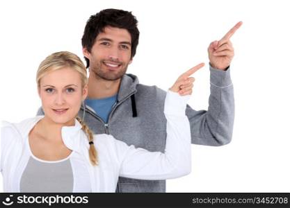 man and woman pointing with finger