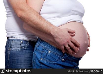 Man and woman&rsquo;s hands over pregnant belly on white