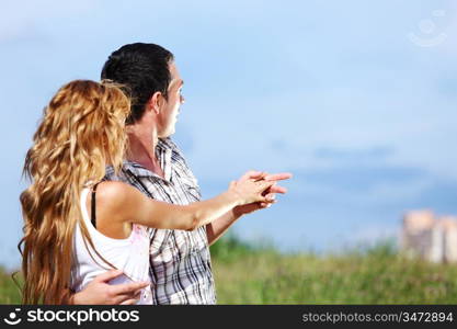 man and woman see houses and new flat