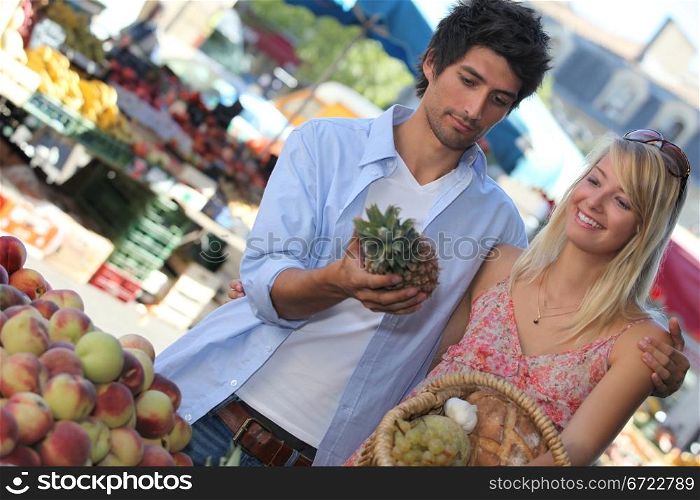 man and woman shopping vegetables