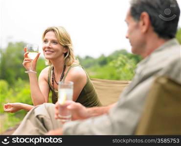 Man and woman sitting drinking selective focus