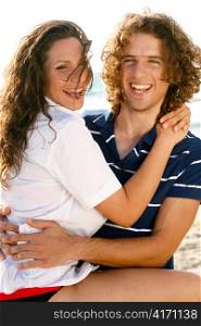 Man and woman smiling and embracing each other