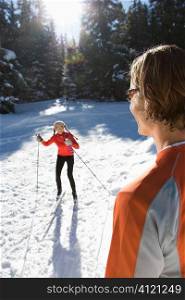 Man and Woman Snow Skiing