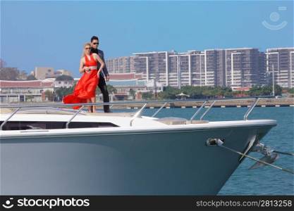 Man and woman stood on boat