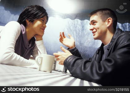 Man and Woman Talking at a Diner