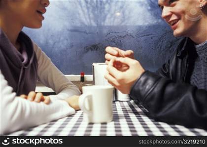 Man and Woman Talking at a Diner