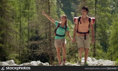 Man and woman walking during excursion on forest trail, young people hiking and trekking on mountains. Part 9 of 12