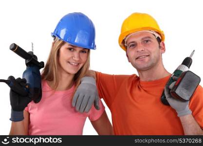 Man and woman with drill