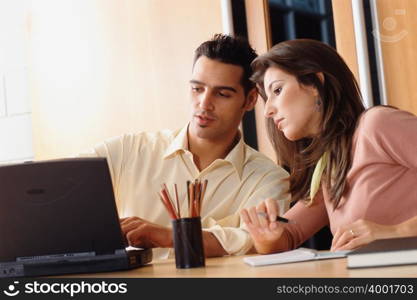 Man and woman with laptop
