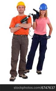 Man and woman with power drills