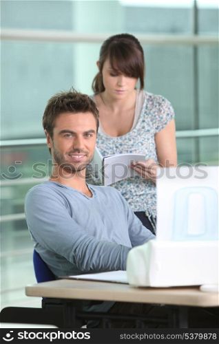 Man and woman with printer