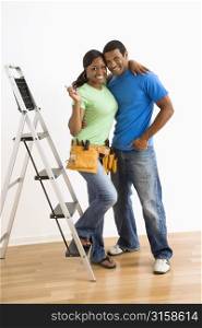 Man and woman with step ladder