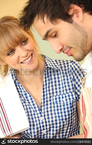 Man and woman with tea towel