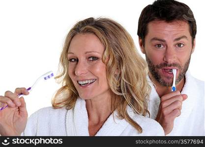 man and woman with toothbrush