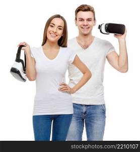 Man and woman with virtual reality goggles. Studio shot isolated on white. Man and woman with virtual reality goggles