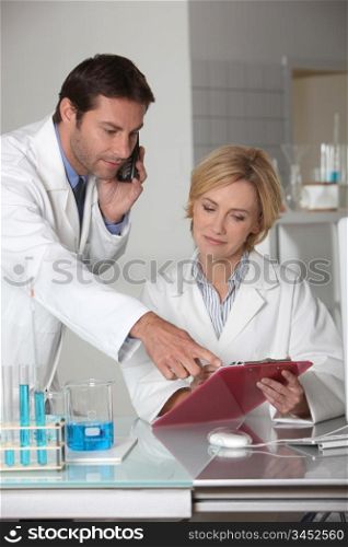 Man and woman working in a laboratory