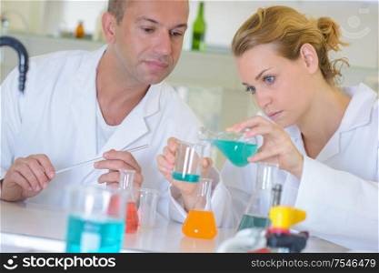 Man and woman working in laboratory