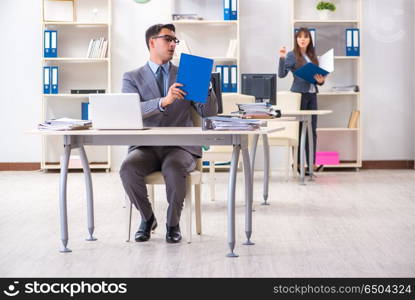 Man and woman working in the office