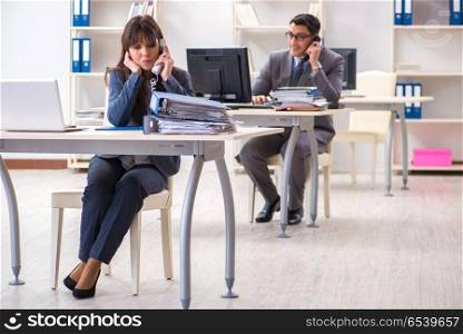 Man and woman working in the office