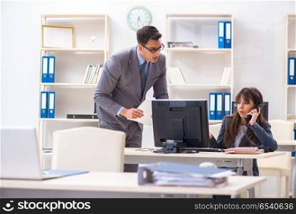 Man and woman working in the office