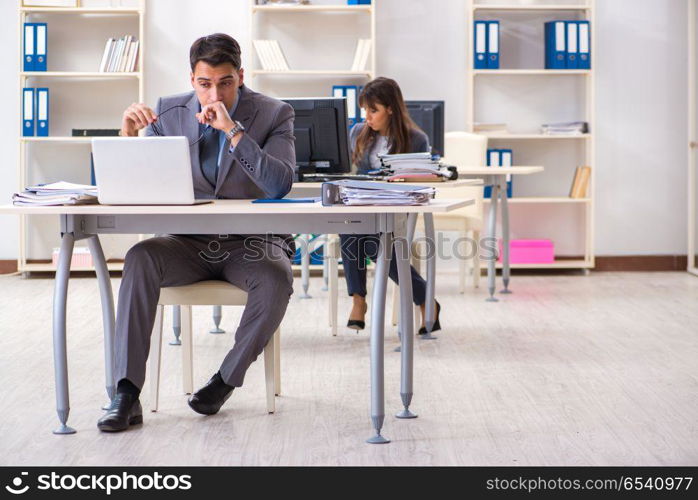 Man and woman working in the office