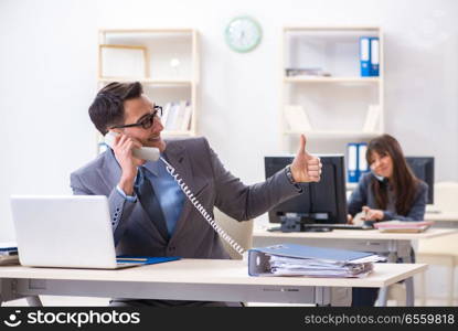 Man and woman working in the office