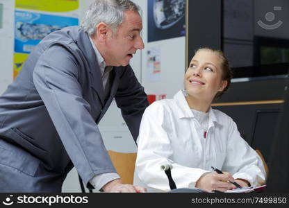 man and woman working in workshop